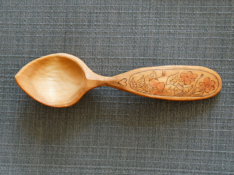hand carved wooden eating spoon, kolrosed floral design