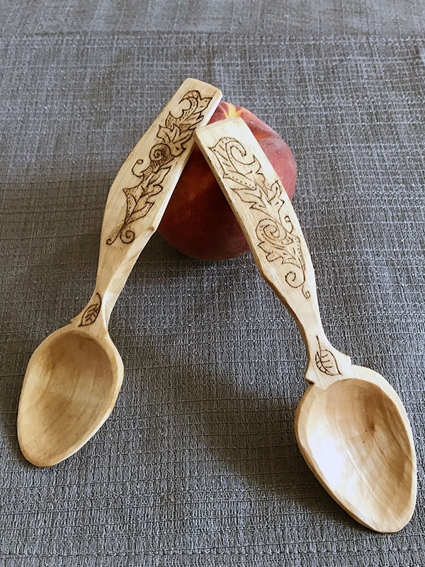 spoons handcrafted from wood. Floral Decoration on handles.